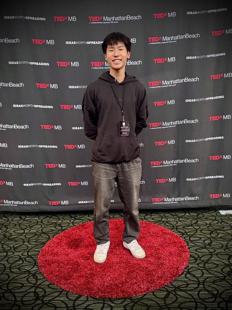 Ethan in front of the TEDxManhattanBeach backdrop